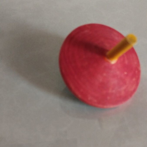 Wooden spinning top used