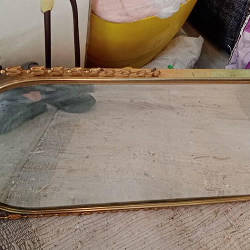 Mirror with metal frame used, gold color
