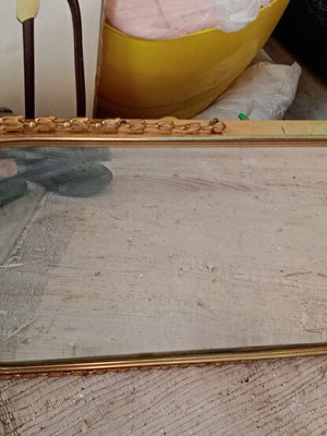 Mirror with metal frame used, gold color