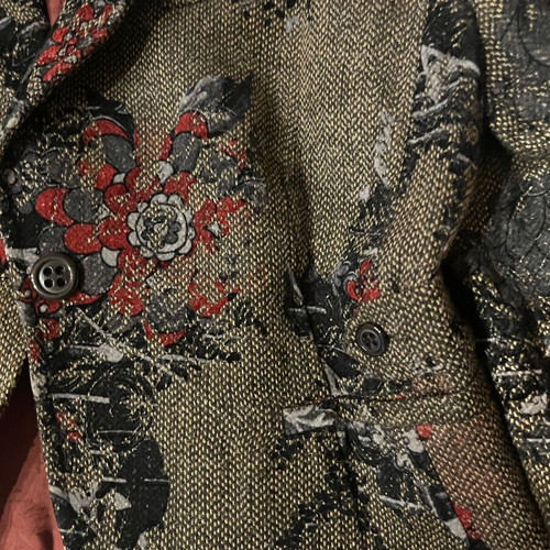 Brown jacket with burgundy patterns and details