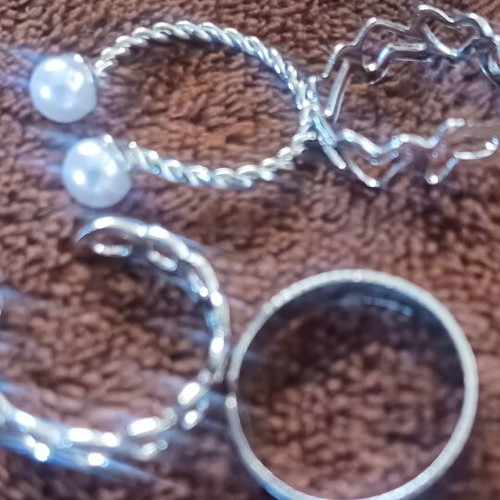 Set of 4 silver rings with different designs