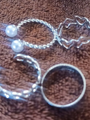 Set of 4 silver rings with different designs