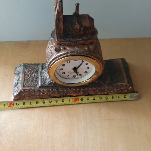 Copper German wind-up clock used with cathedral motif