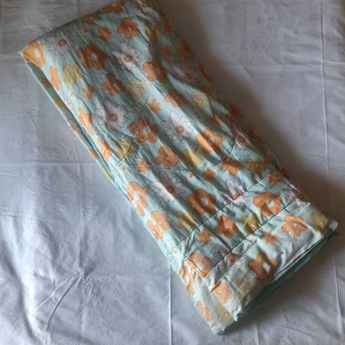 Single quilt used with two sides, floral and blue