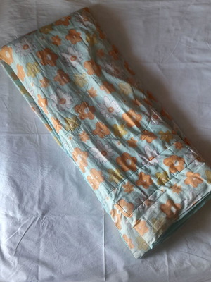 Single quilt used with two sides, floral and blue