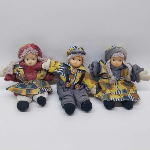 Three small collector dolls with ceramic faces like new
