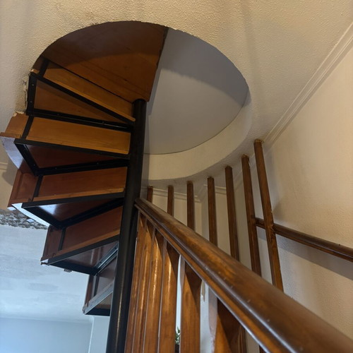 Wooden indoor staircase used with storage