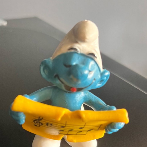Collectible Smurf figure with musical scroll like new
