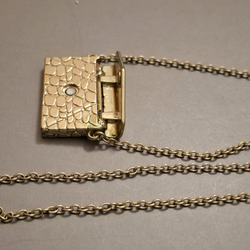 Abysse pendant bag in gold tone with chain used