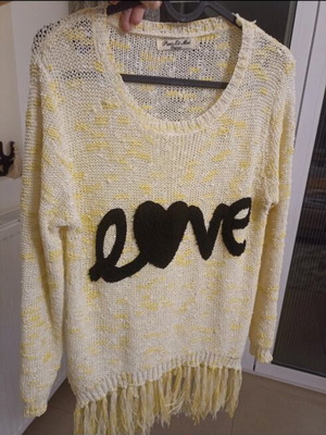 Knitted sweater like new, perforated, yellow with print