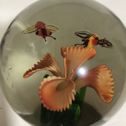 Handblown glass dome paperweight with stylized bees