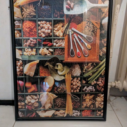 Puzzle frame with pasta and spices like new