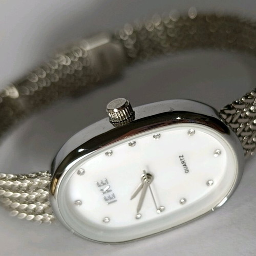 Silver women's watch like new with mesh bracelet and rhinestones