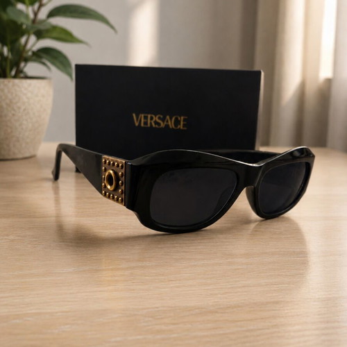 Versace collectible sunglasses, black lenses and frame