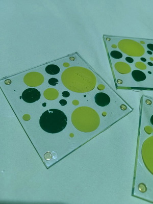Glass coasters like new with green designs, set of 3