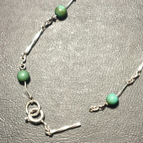 Silver bracelet with green beads used, needs repair