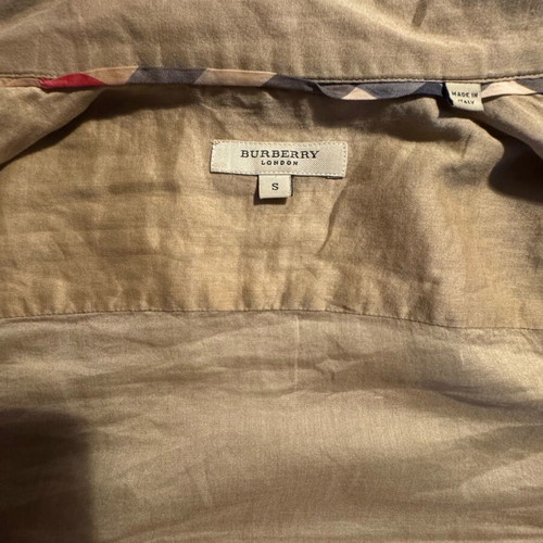Burberry shirt used in beige satin shade with gold details