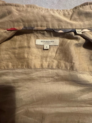 Burberry shirt used in beige satin shade with gold details