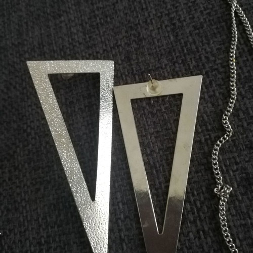 Various silver jewelry including earrings, body chain, rings, and necklace