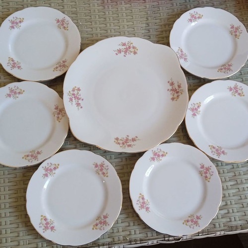 Vintage porcelain platter with six Bohemia Thun plates in excellent condition
