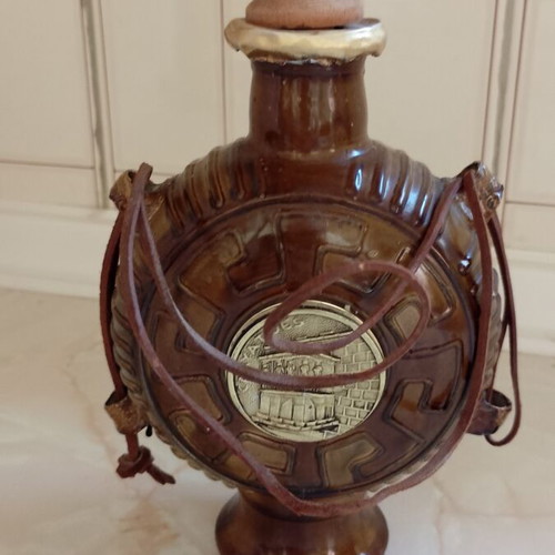 Vintage souvenir vermouth bottle with leather strap and wooden stopper like new