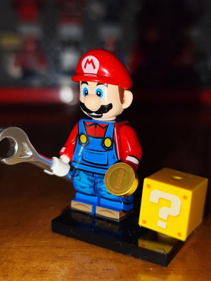 Mario figure like new with base, question mark box, coin, silver tool