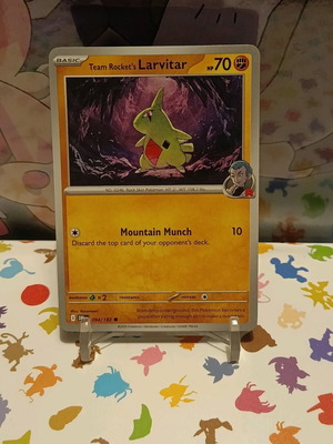 Team Rocket's Larvitar Pokémon card like new, DRI 094