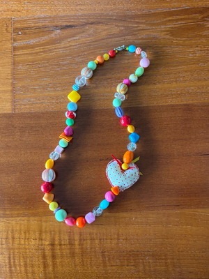 Necklace with colorful beads like new with fabric elements