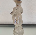 Porcelain decorative figure of man used with musical instrument