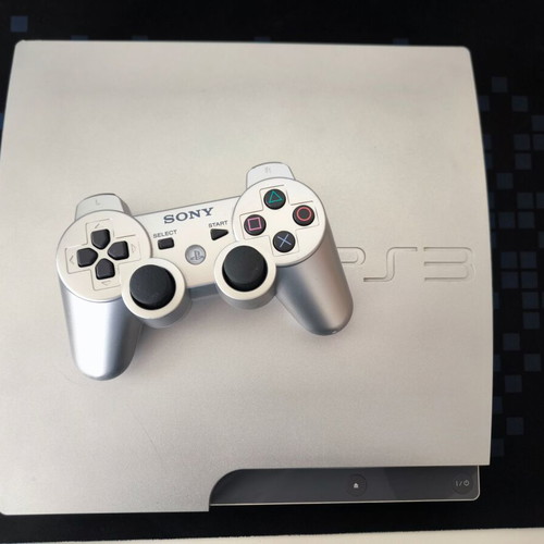 Sony PlayStation 3 Slim Satin Silver 320GB console with original DualShock 3 used