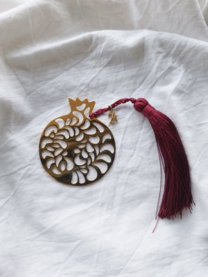 Handmade lucky charm with metal elements and tassel made to order