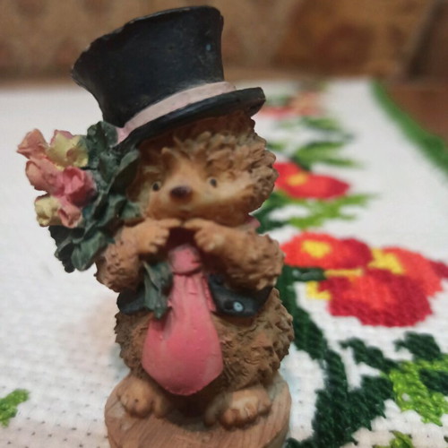 Hedgehog miniature figurine used, decorative with hat and flowers