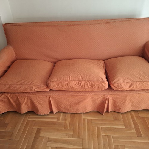Vintage three-seater sofa and two antique armchairs with dark wood frame