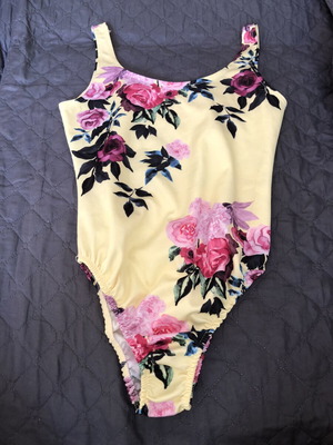One-piece colorful swimsuit with flowers for children like new