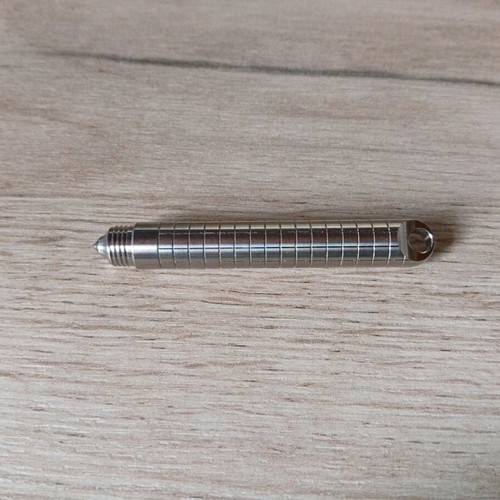 Mini titanium pen like new with Frag Pattern and carbide tip