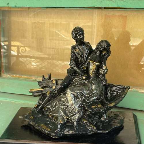 Vintage statue of a loving couple with wooden base like new