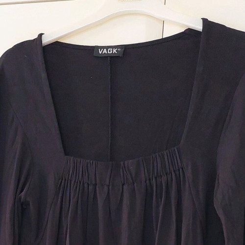Black long-sleeve blouse with a square bust