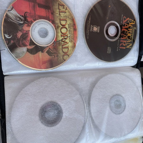 Vintage PC and PlayStation 2 gaming bundle with case, 70 CDs/DVDs