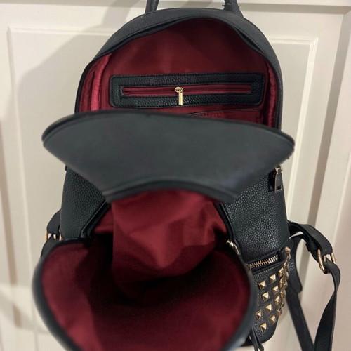 Black backpack used with studs