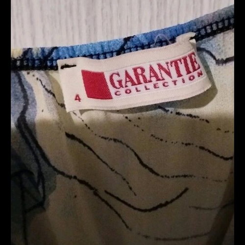 Garantie asymmetrical blouse like new