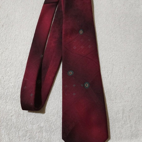 Red tie with patterns used