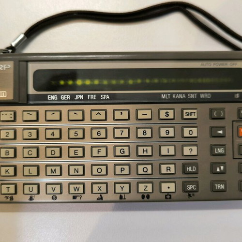 Sharp IQ-3100 electronic translator used with 2 modules and case