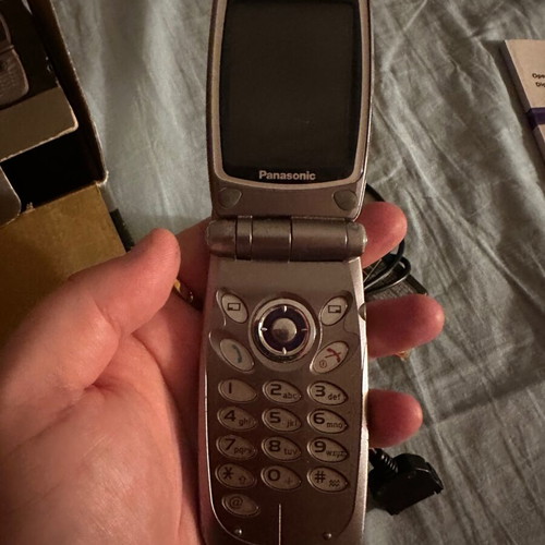 Panasonic EB-GD87 mobile phone used with box and charger needing repair