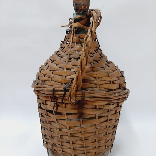 Dame-Jeanne vintage demijohn used, light blue glass with wicker