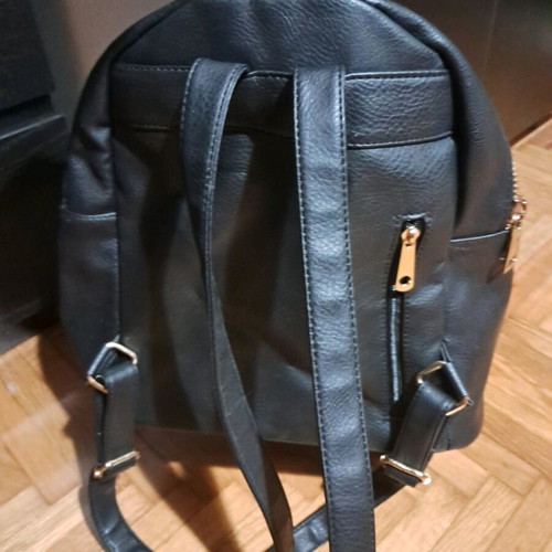 Black backpack with gold zippers like new