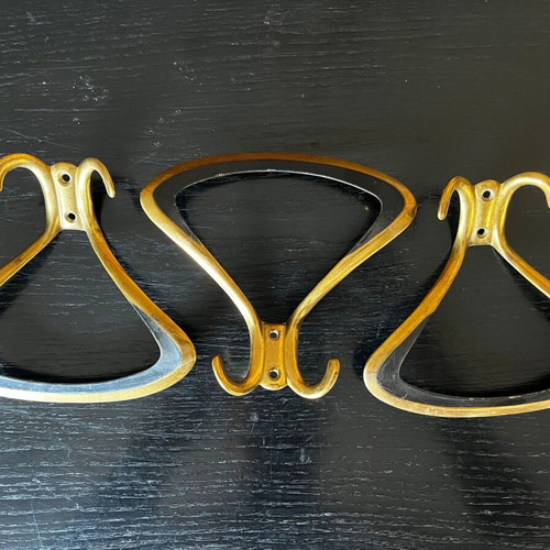 3 gold metal wall hooks