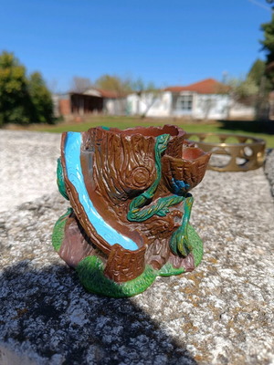 Clay cup holder/plant pot used, designed like a plane tree