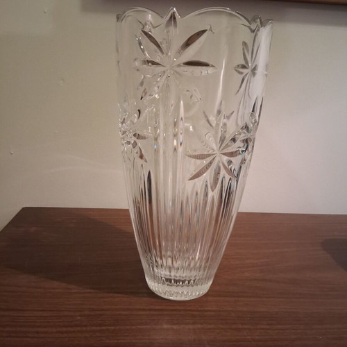 Vintage crystal vase with embossed stars and daisies used