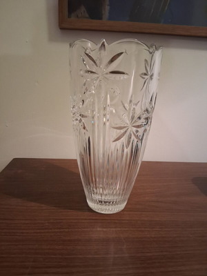 Vintage crystal vase with embossed stars and daisies used
