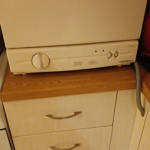 Carad countertop dishwasher used, functional with loose button